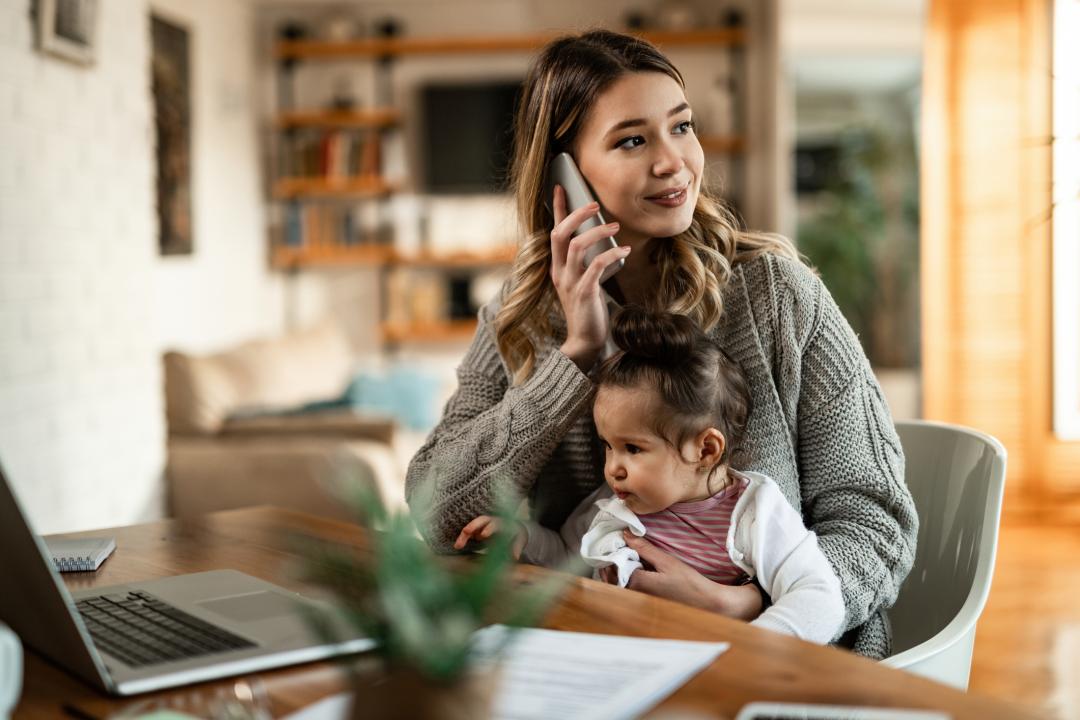 Woman talking on the phone in her home