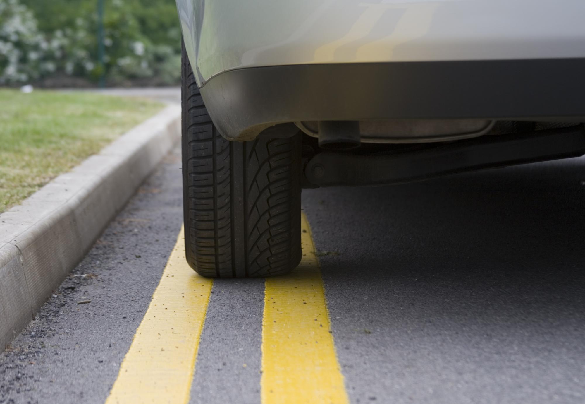 Car parked on yellow lines