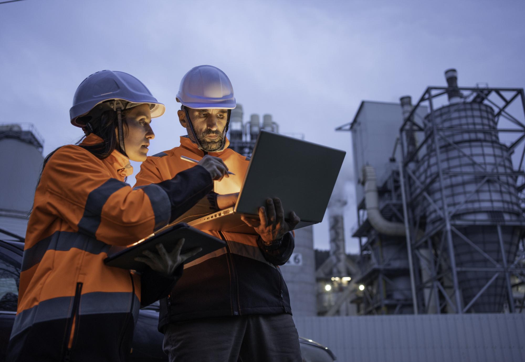 Engineers working late in power plant