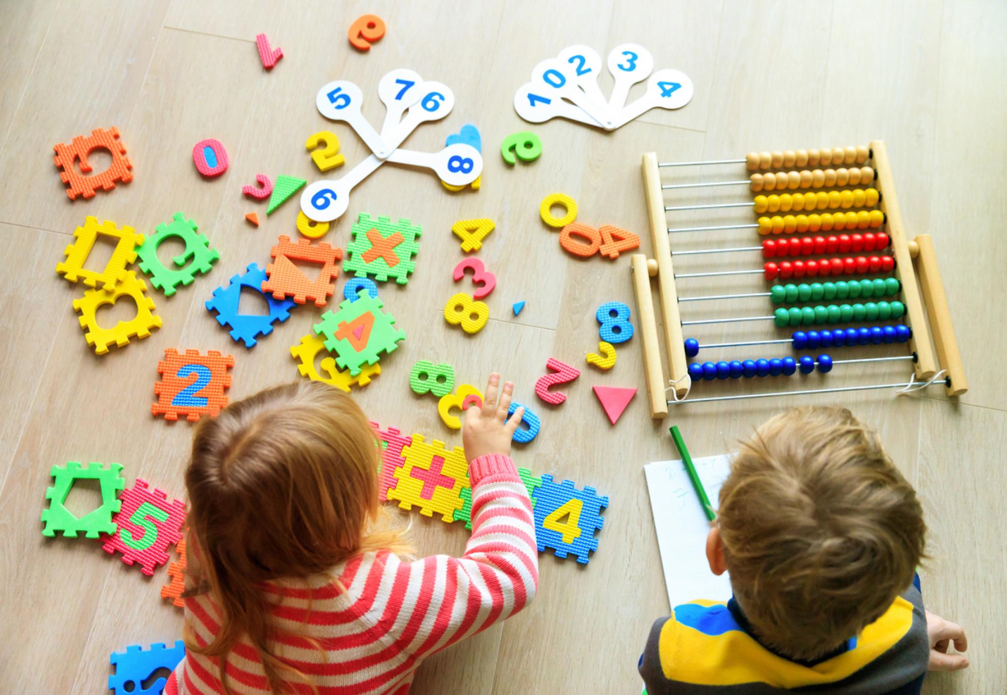 Two small children learning together 