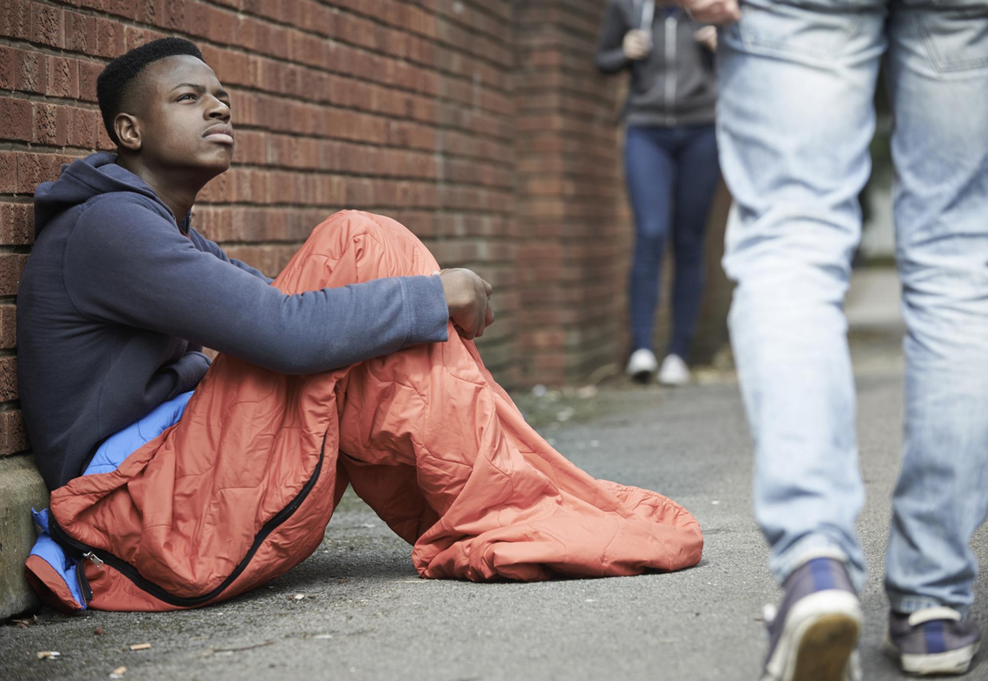 Homeless teenager sleeping on the street