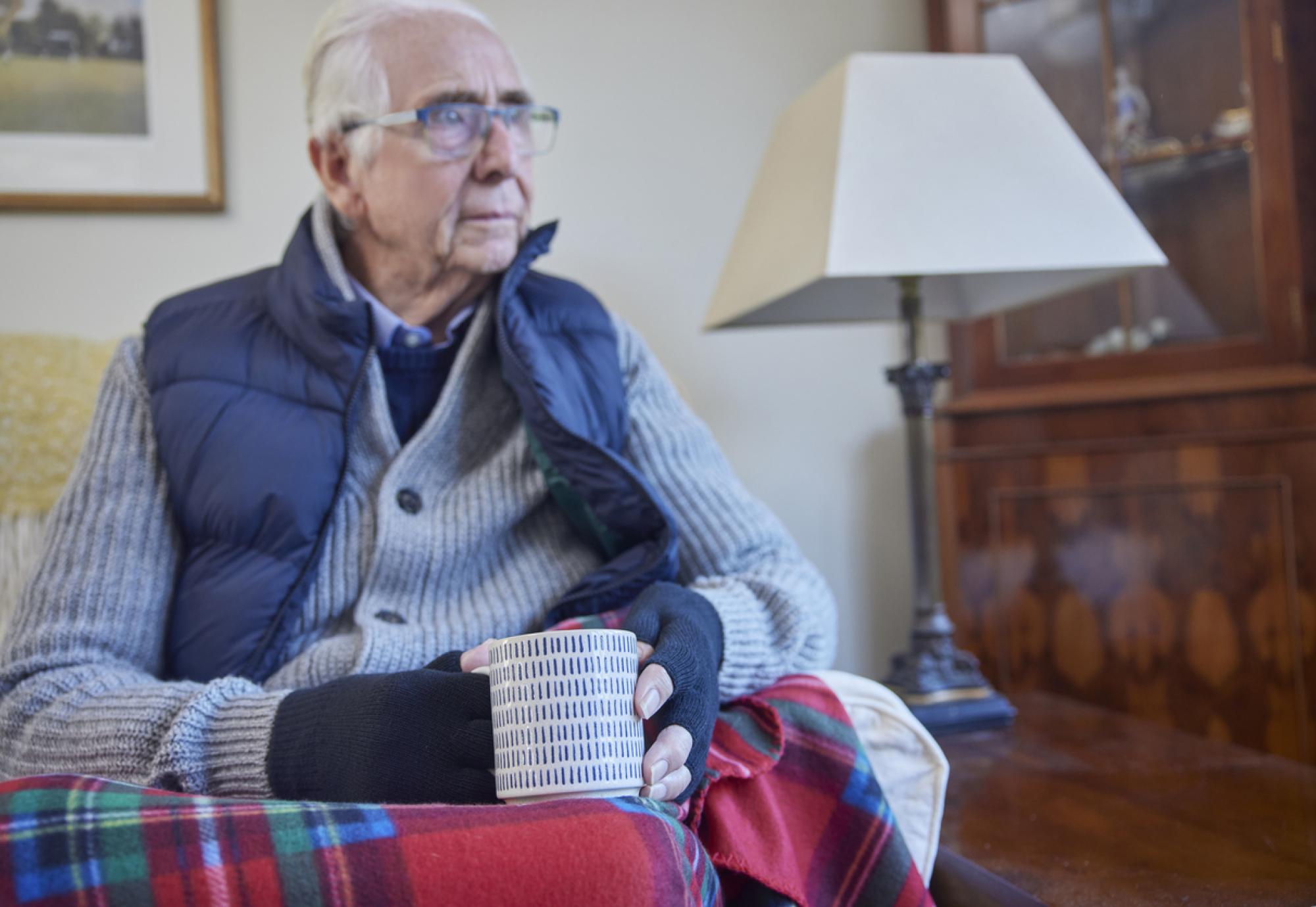 Older man struggling to keep warm in the winter