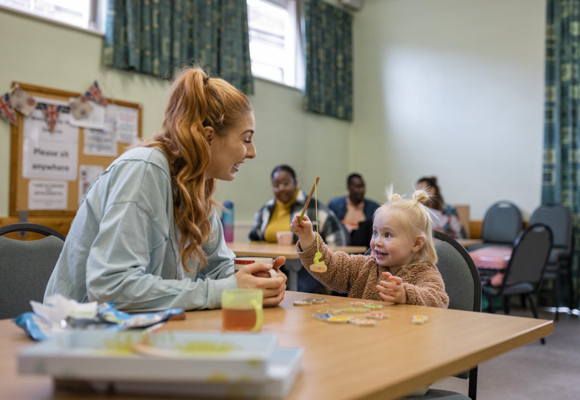 Mother and young girl relying on youth services