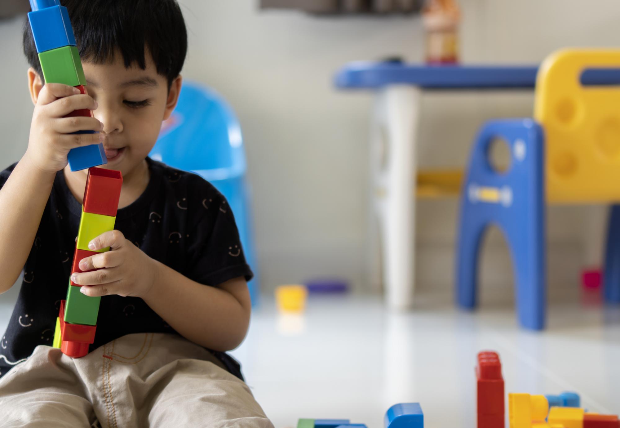 Small child playing with blocks