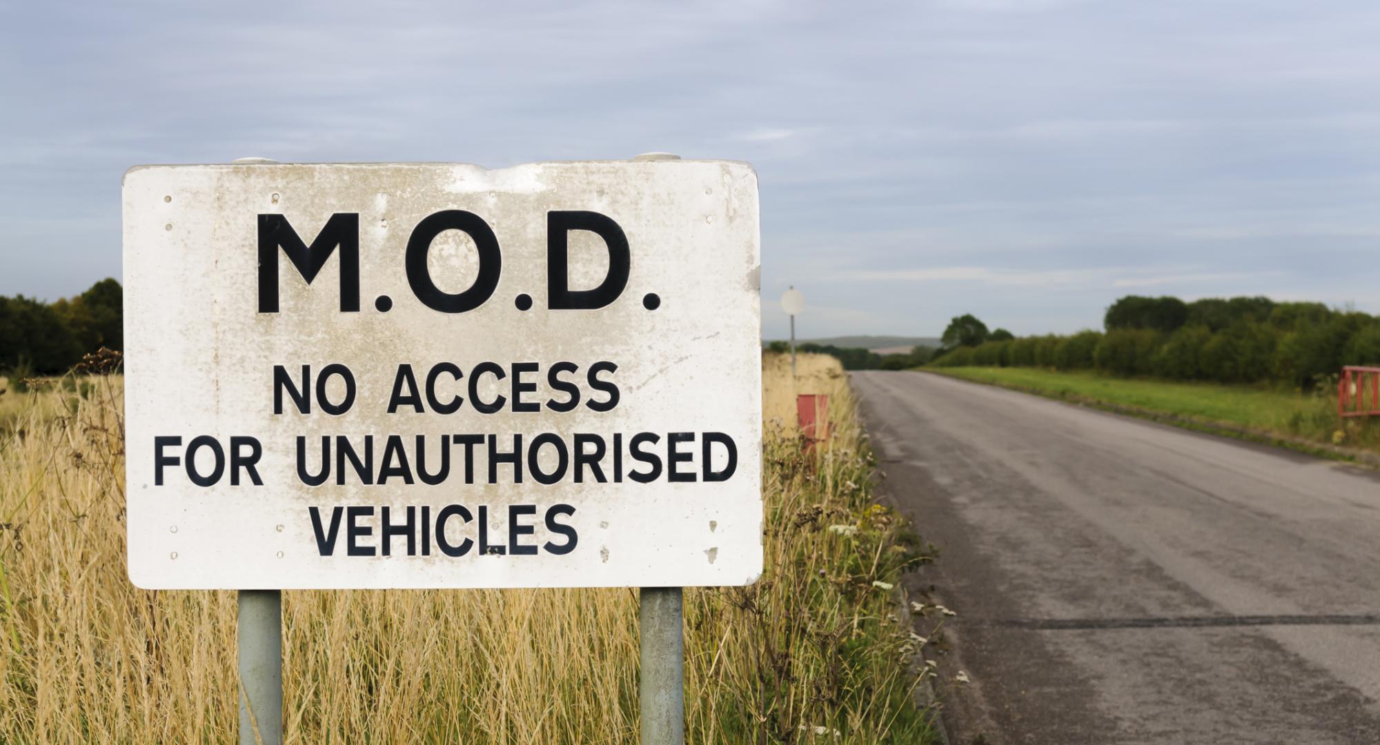 Sign warning public that a road belongs to the MOD and is private.