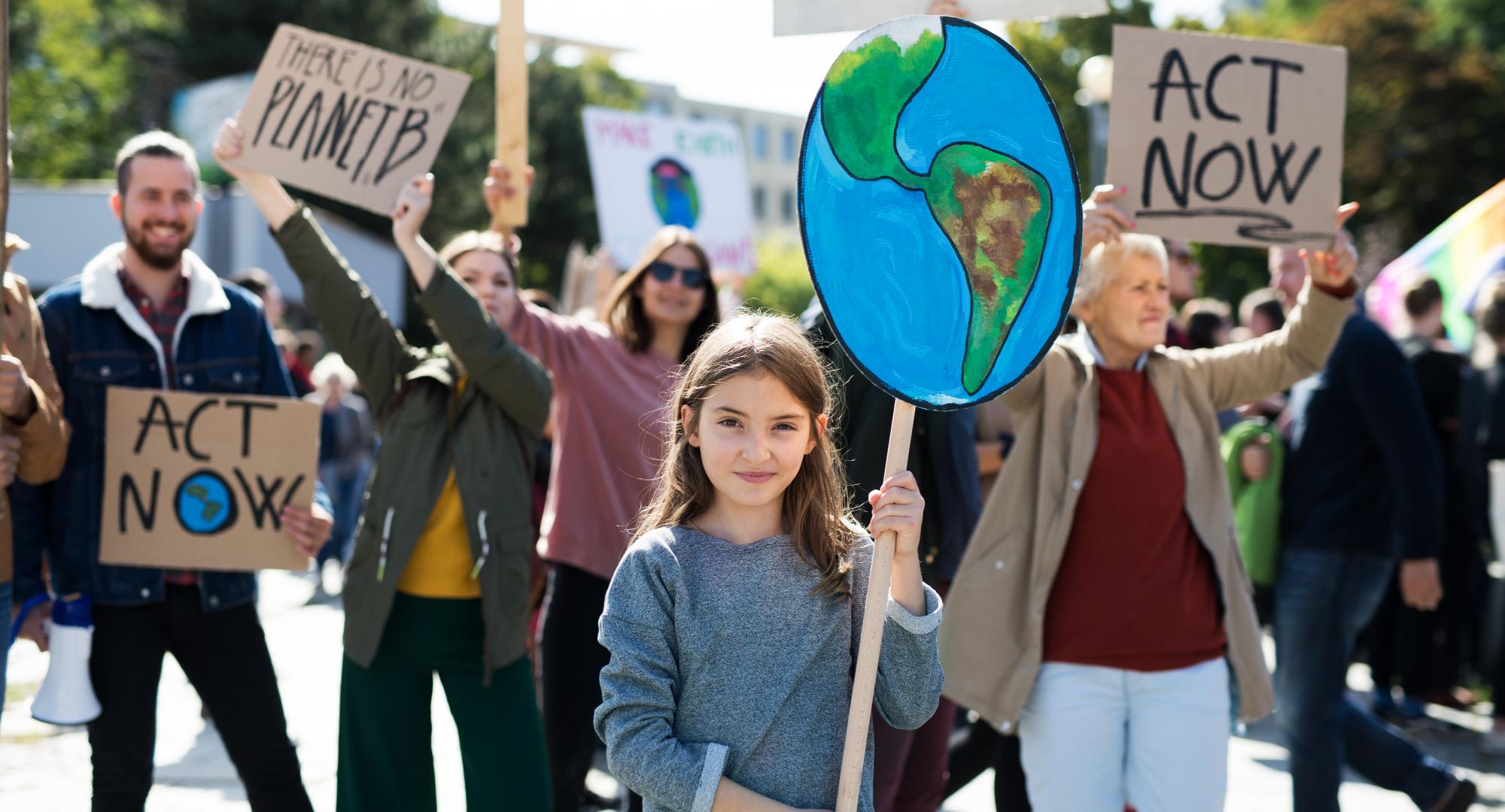 People with placards and posters on a global strike for climate change.