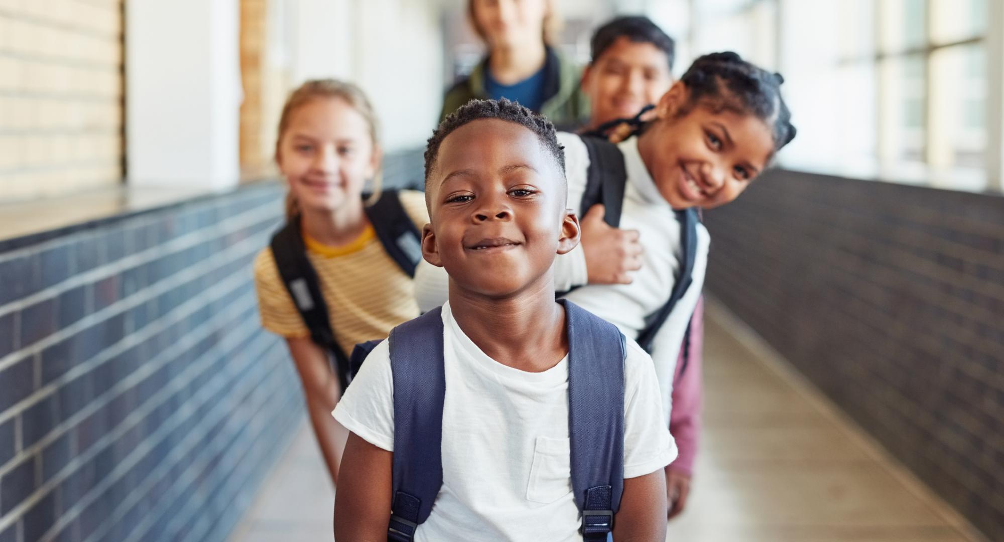 Multiracial school children together. 