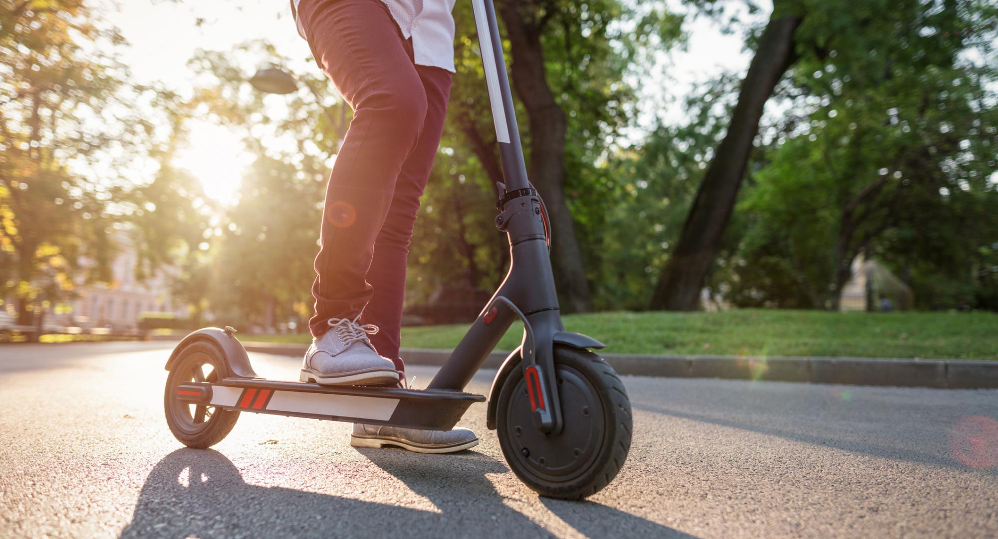 Man rides e-scooter