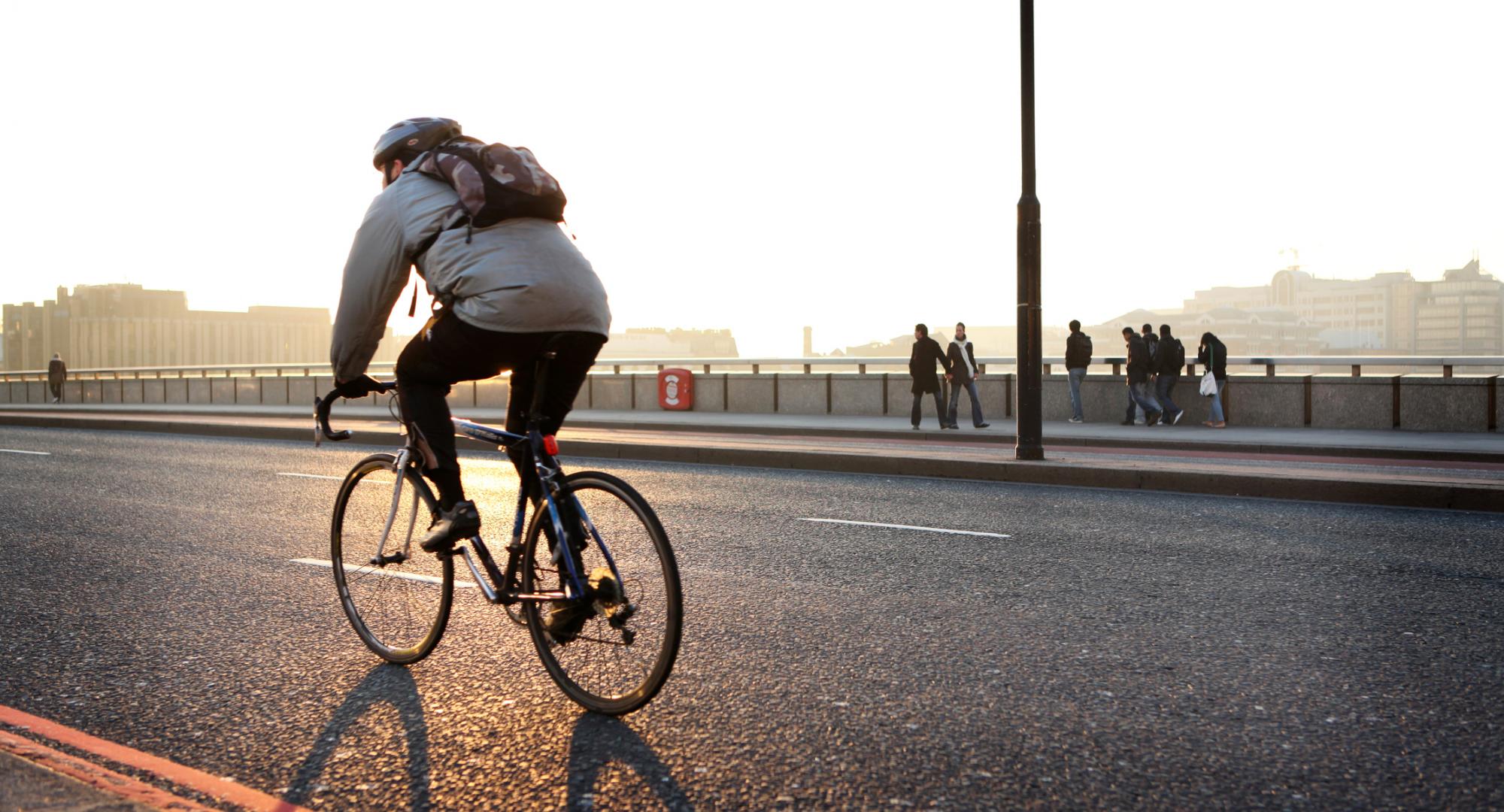 Man commutes to work on bicycle.