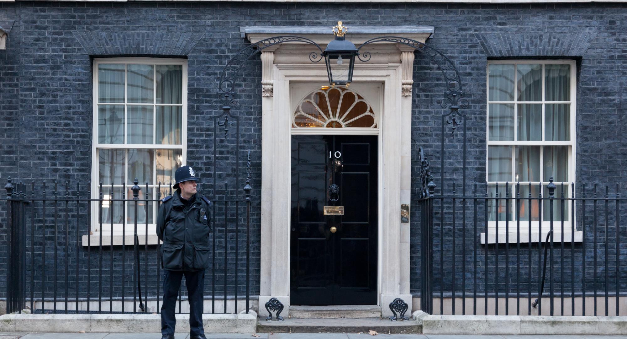 Policeman stands guard outside 10 Downing Street.