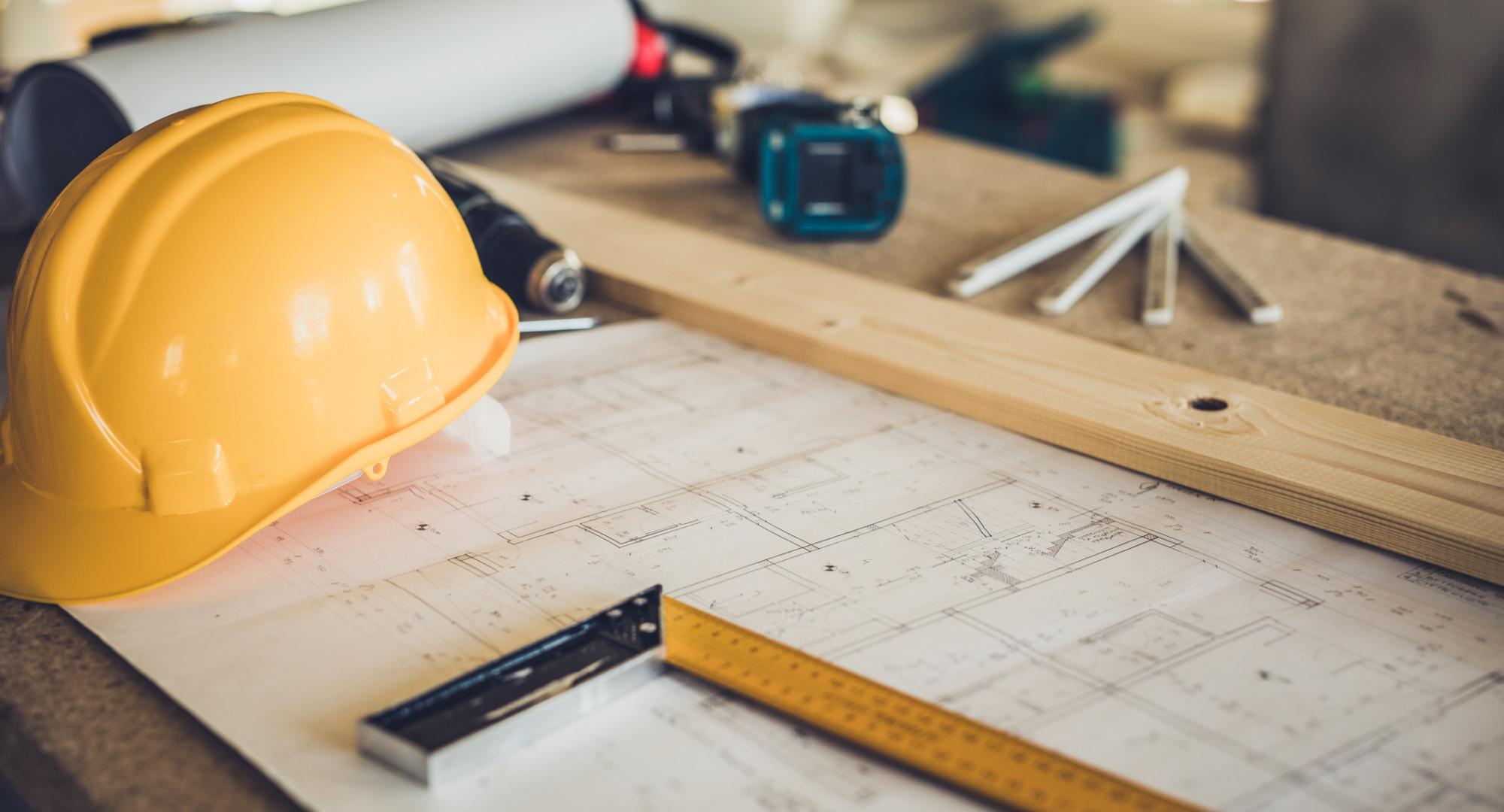 Hard hat and assorted construction items on a table