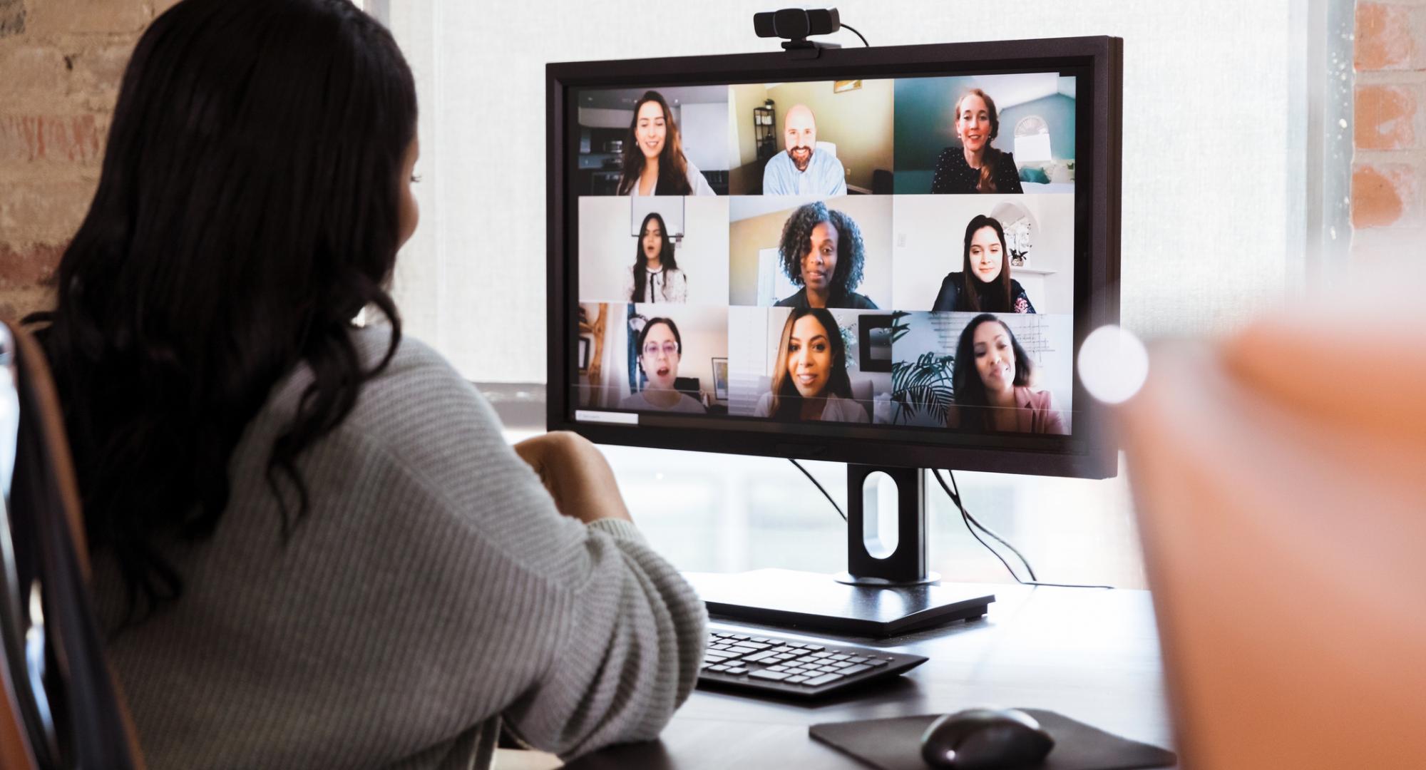 Remote worker on a video call with colleagues