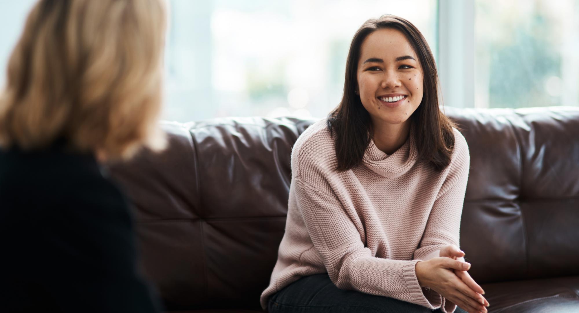 Woman speaking to mental health counsellor