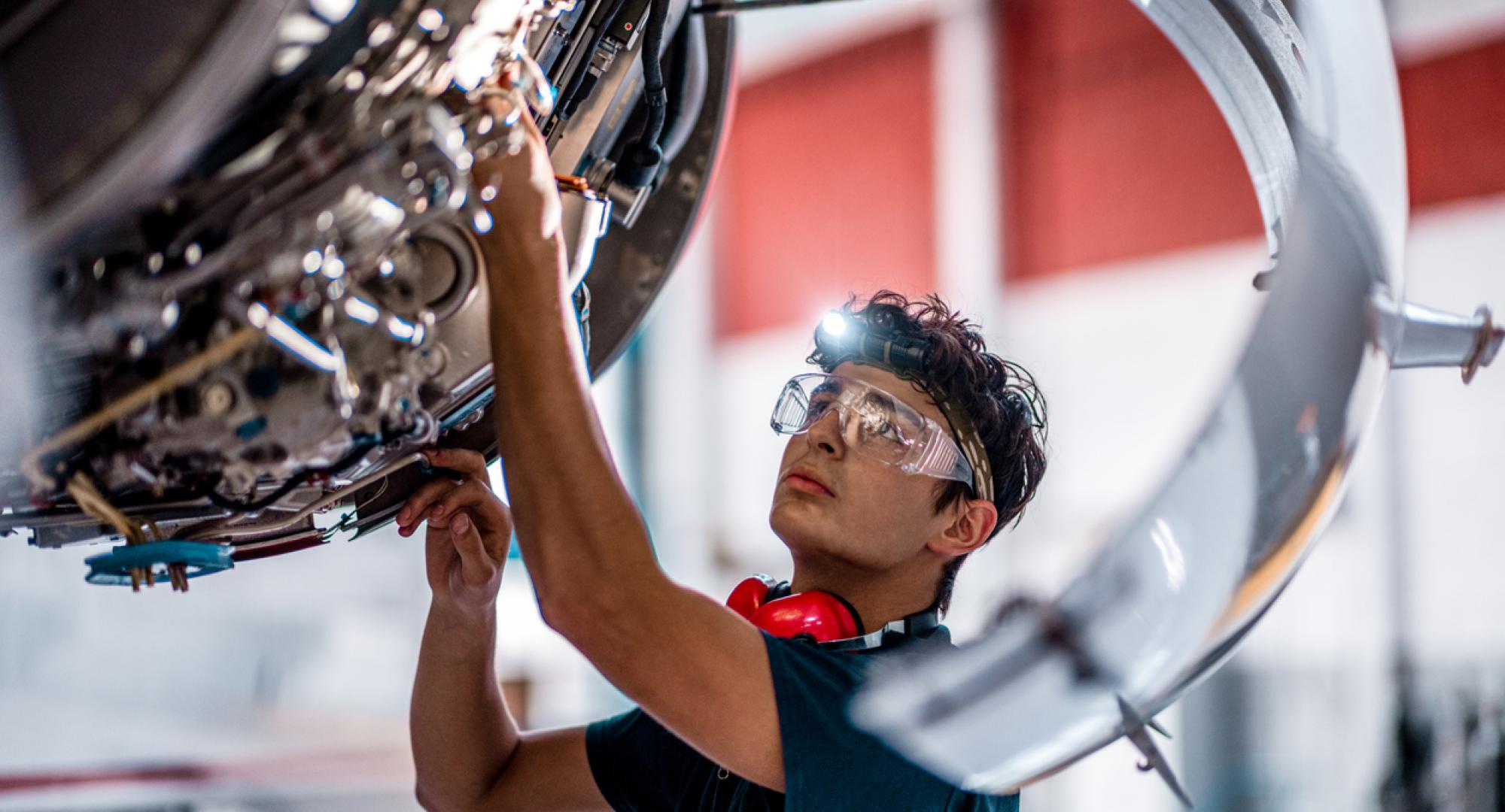 Male engineer working on an engine