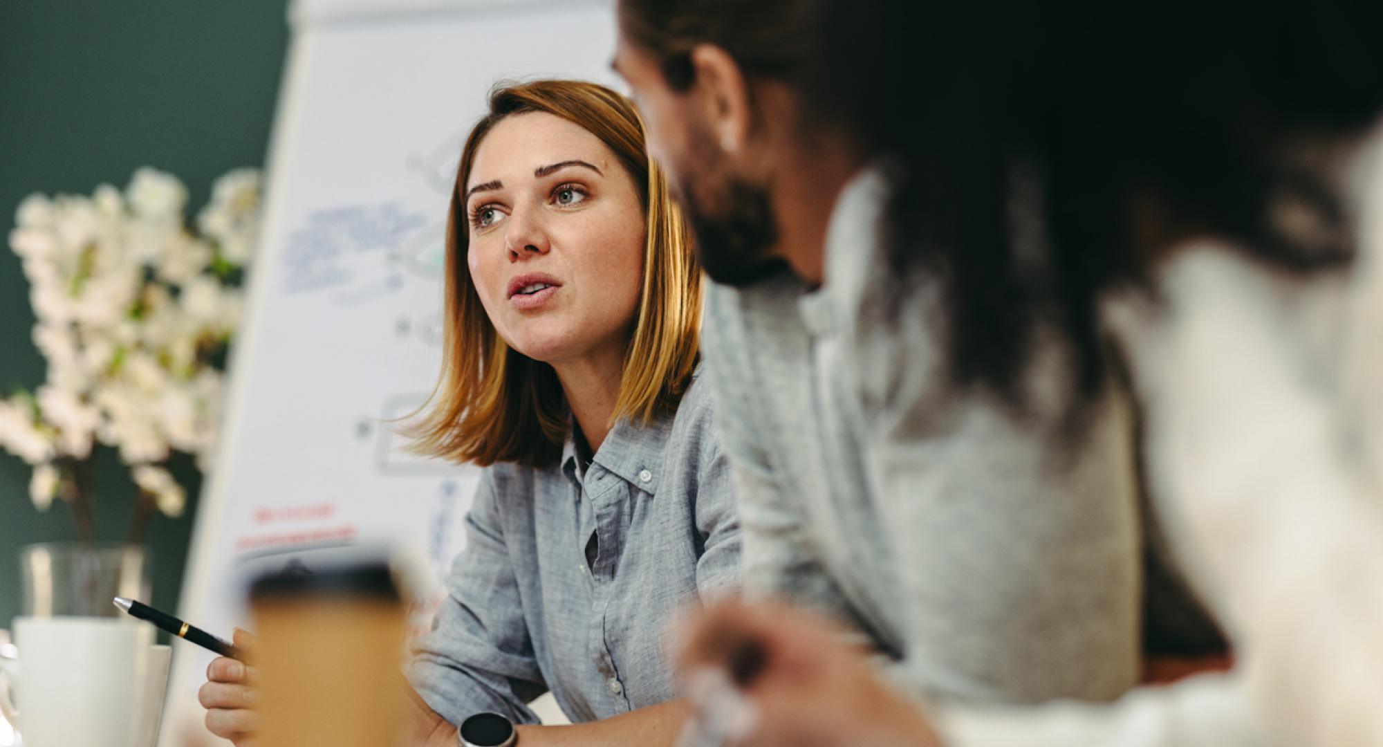 Young businesswoman having a discussion with her colleagues