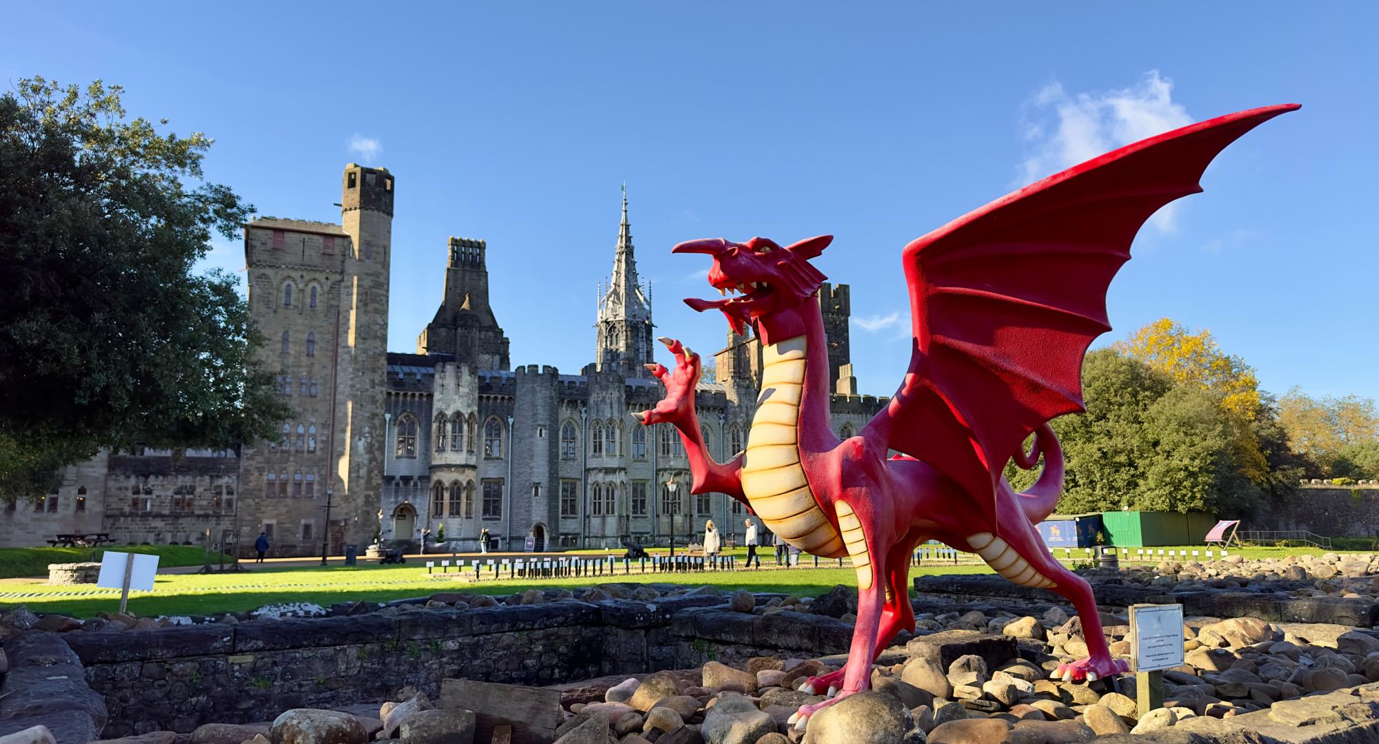 A red dragon in front of the Cardiff Castle