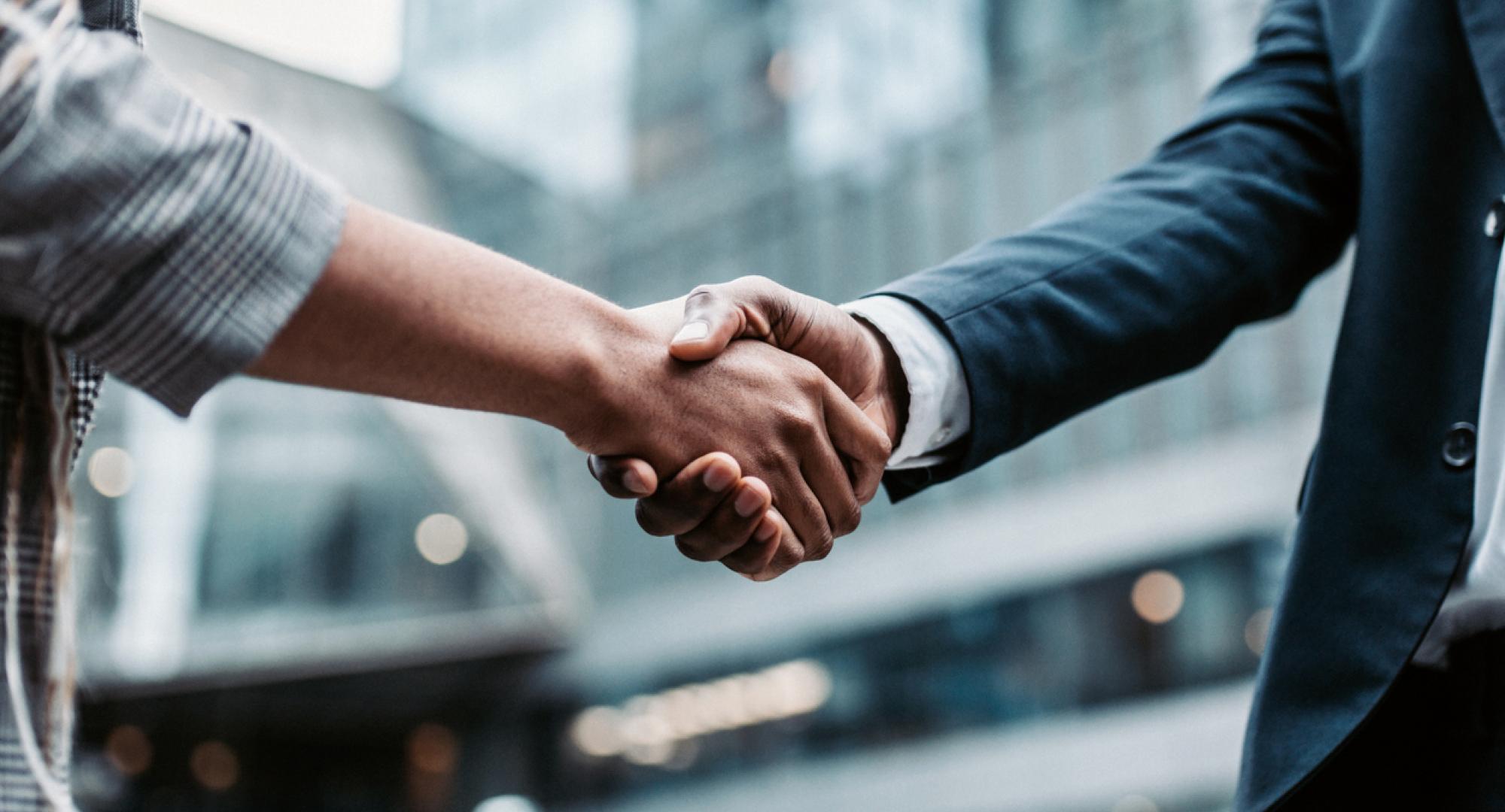 Two people shaking hands after meeting