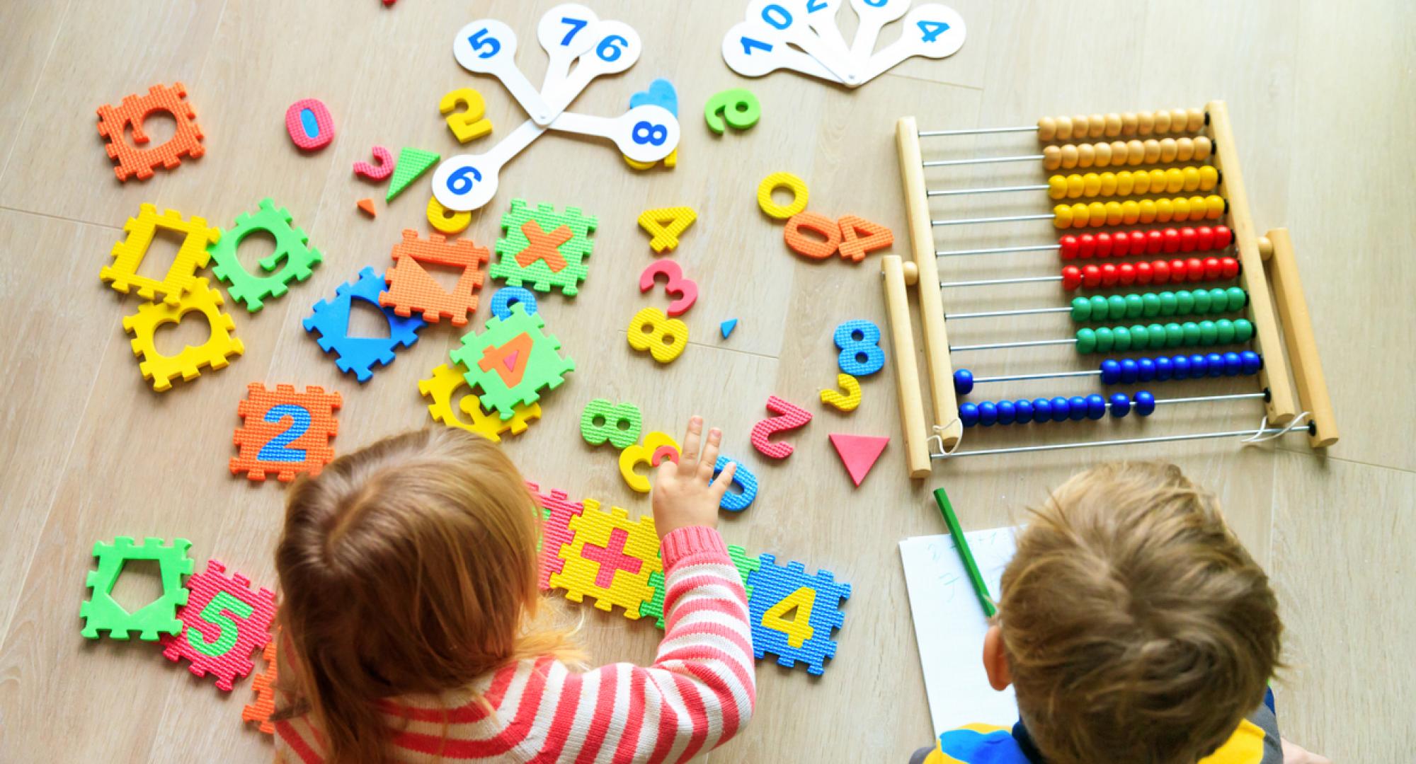 Two small children learning together 