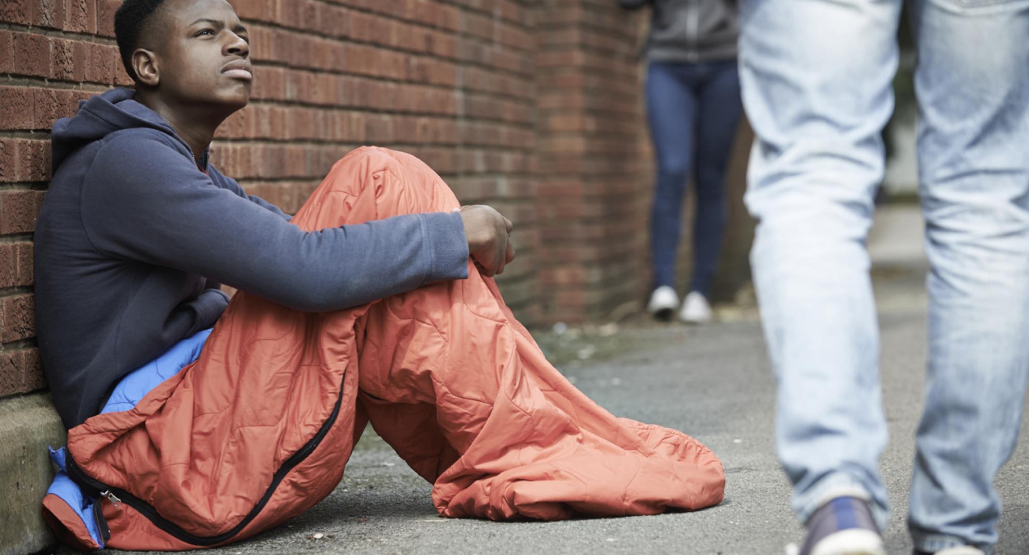 Homeless teenager sleeping on the street