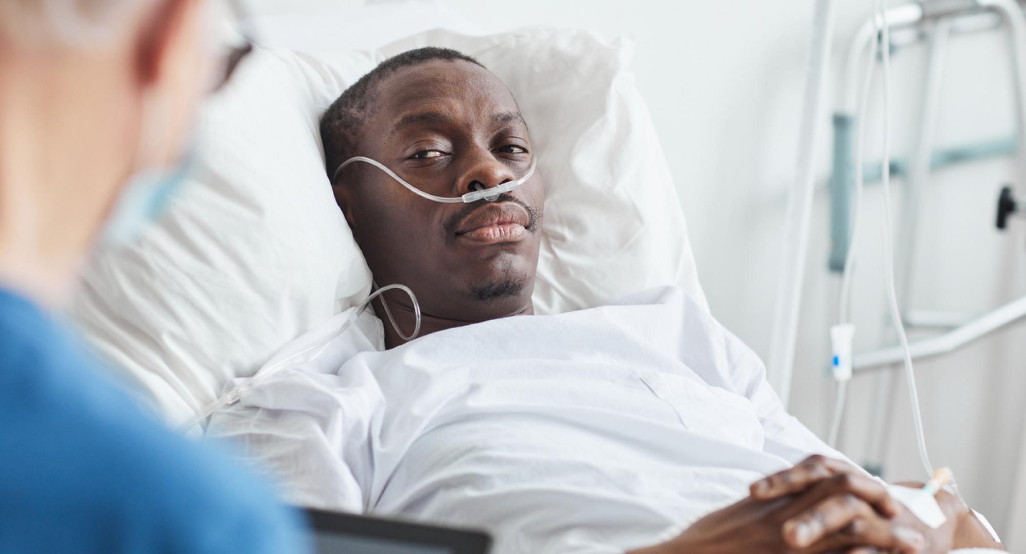 Man laying in a hospital bed