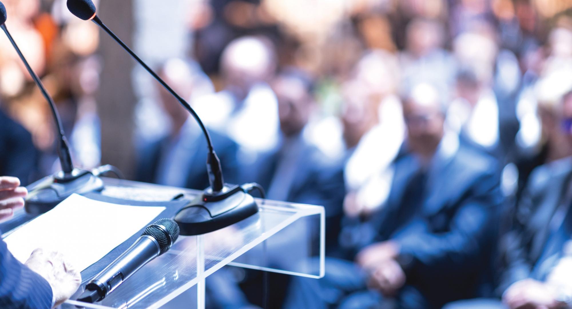 Person speaking at an awards ceremony