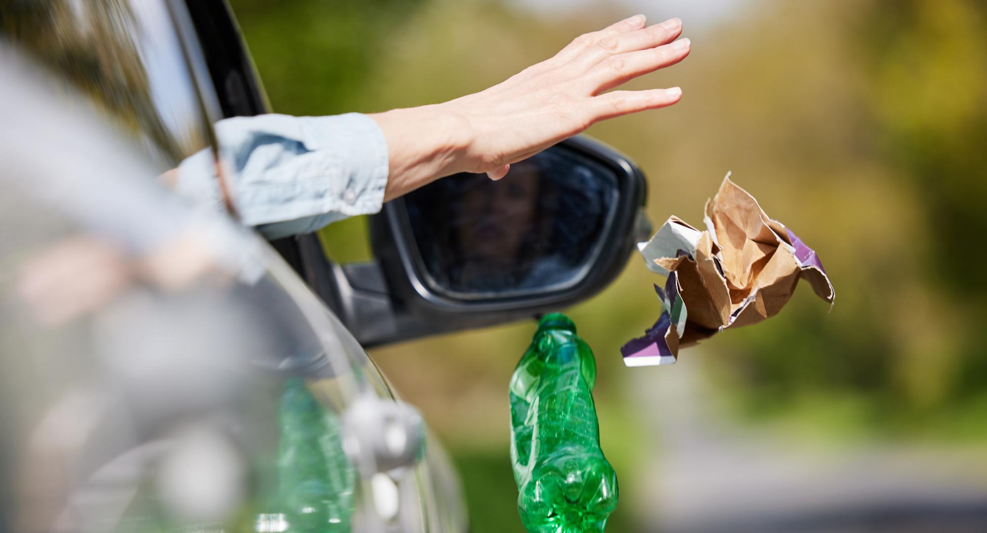 Person throwing rubbish from a car