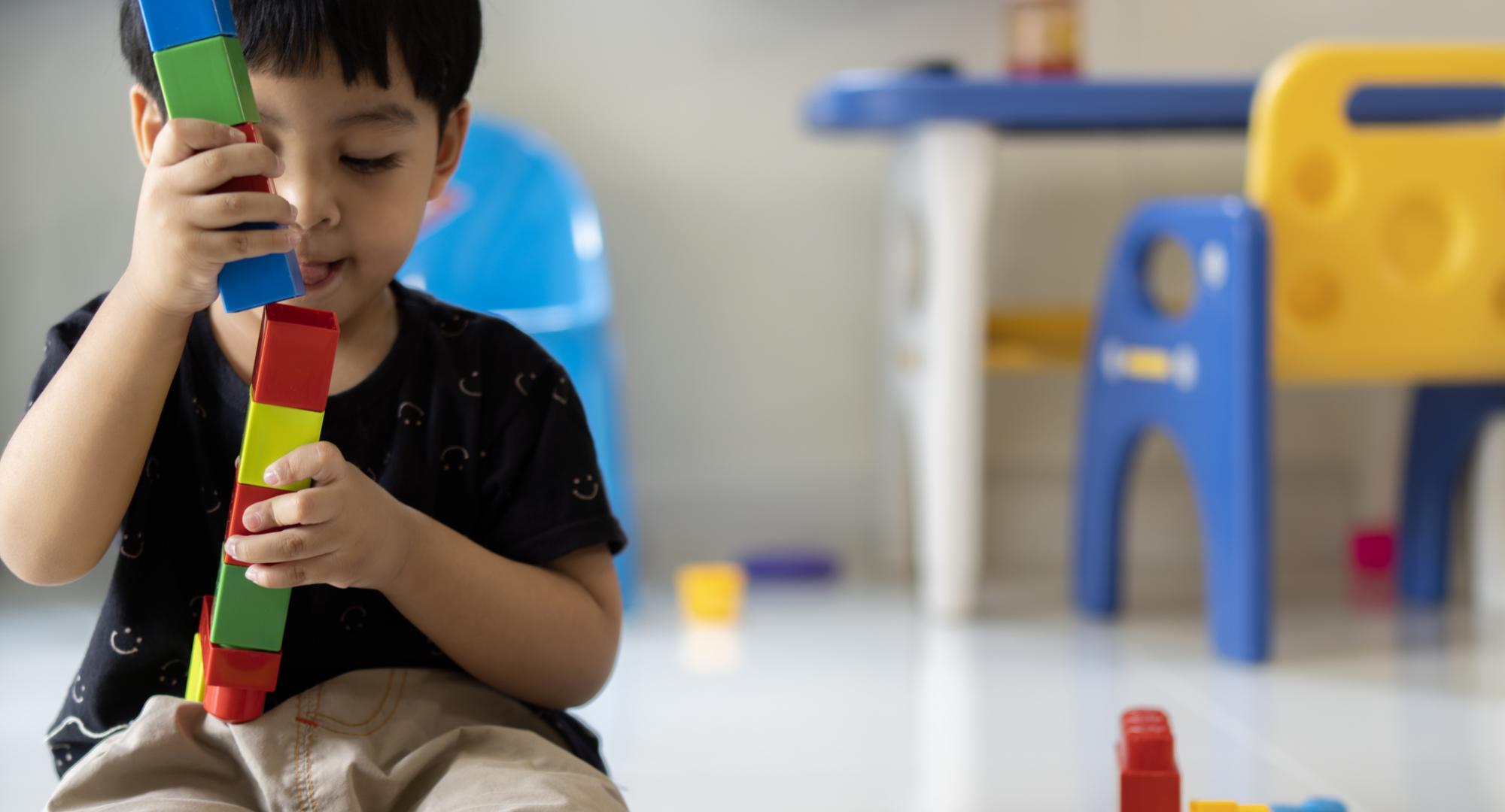 Small child playing with blocks