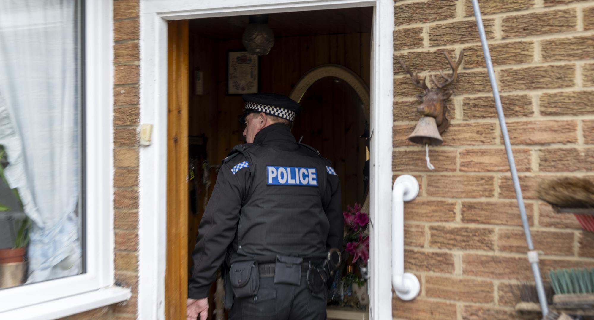 Police Officer entering someone's home