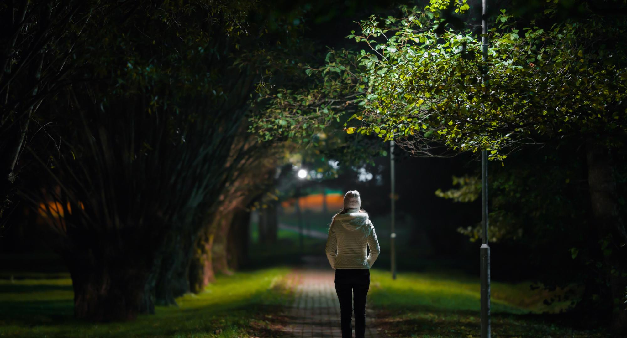 Woman walking at night