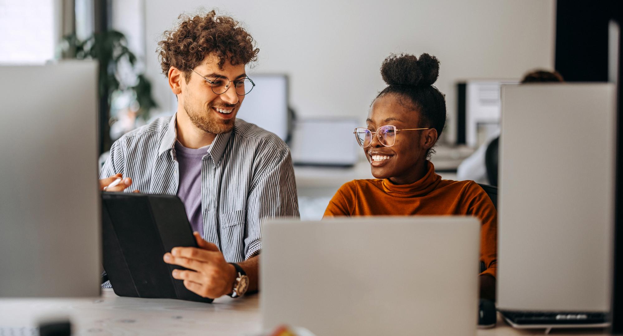 Two young people on computers