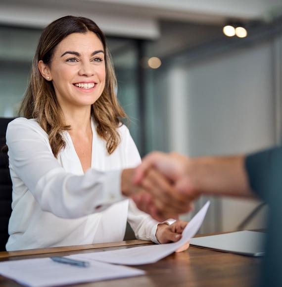 Public sector worker smiling and shaking hands