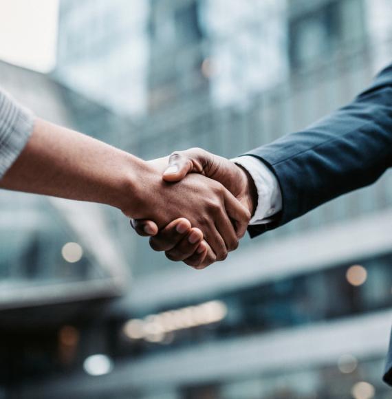 Two people shaking hands after meeting