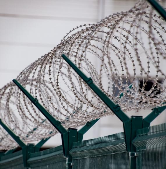 Barbed wire on the top of a prison fence