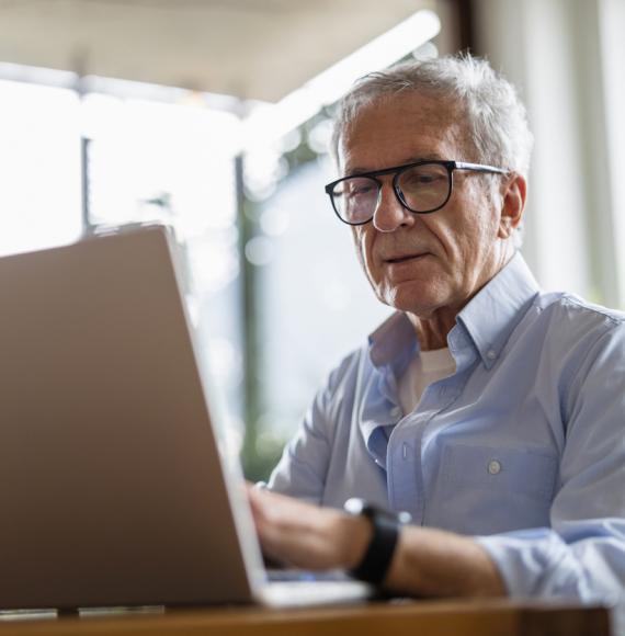 Senior man using laptop