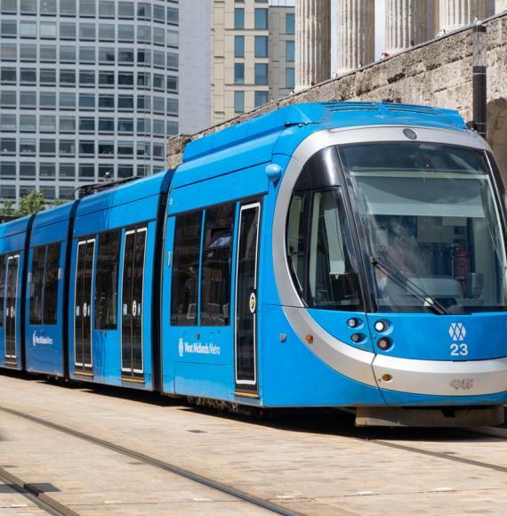 A blue West Midlands Metro tram