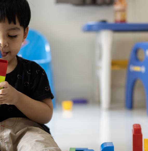 Small child playing with blocks